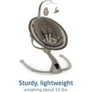 Maxi-Cosi Cassia Smart Baby Swing in Truffle color, featuring soft seating, safety straps, and a mobile with an owl and clouds.