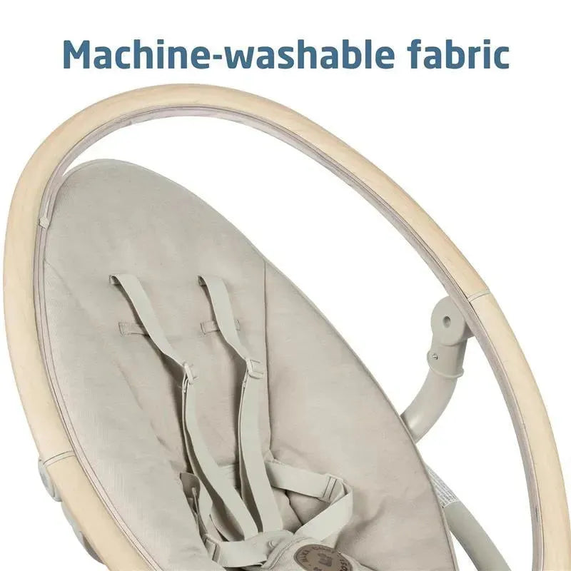 Maxi-Cosi Cassia Swing in Classic Oat with machine-washable fabric and safety harness visible.