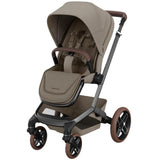 Maxi-Cosi Fame Modular Stroller in Twillic Truffle, featuring a tan fabric seat, adjustable canopy, and sleek design.