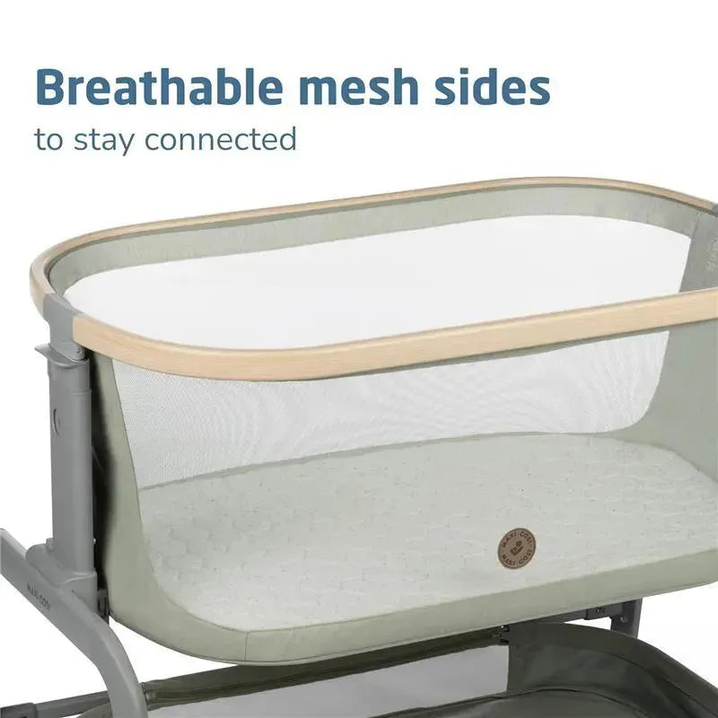 Maxi-Cosi Iora Bedside Bassinet in Classic Graphite, featuring breathable mesh sides and a comfortable sleeping surface.