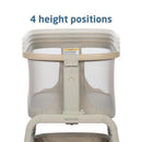 Maxi-Cosi Iora Bedside Bassinet in Classic Oat with a sturdy frame, mesh sides, and adjustable height settings.