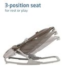 3-position Maxi-Cosi Kori baby bouncer seat in truffle, suitable for infants to rest or play.