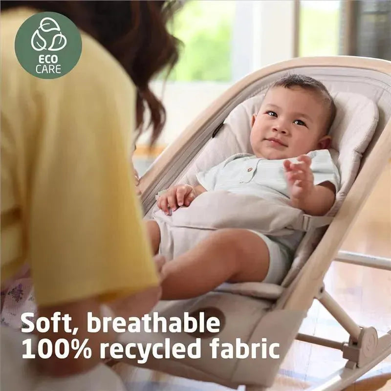Maxi-Cosi Kori 2-in-1 Rocker in Classic Graphite with a smiling baby seated, showcasing soft, breathable 100% recycled fabric.