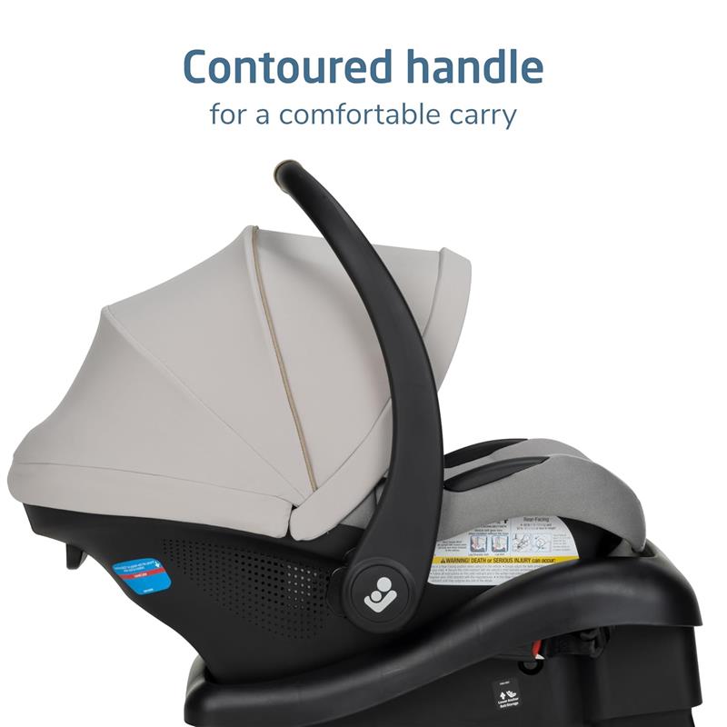Maxi-Cosi Mico Pro Infant Car Seat in Sea Drift color, featuring a contoured handle for comfortable carrying and safety labels.