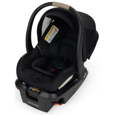 Maxi-Cosi Mico Pro+ infant car seat in Sea Shadow color, featuring a black fabric with safety labels and a carrying handle.
