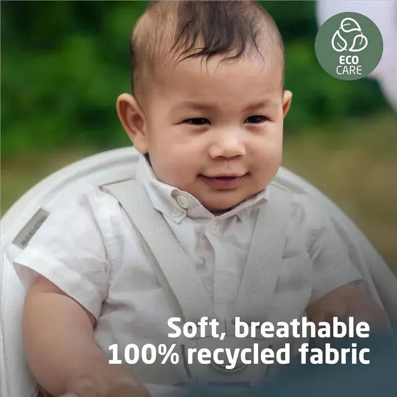Maxi-Cosi Moa 8-in-1 Highchair in Classic Green with a baby smiling, featuring soft, breathable 100% recycled fabric.