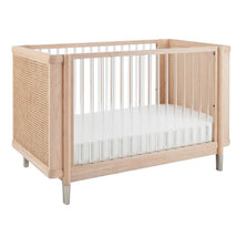 Maxi-Cosi Nursery Brisa 4-in-1 Convertible Crib featuring natural wood, woven sides, and a white mattress platform.
