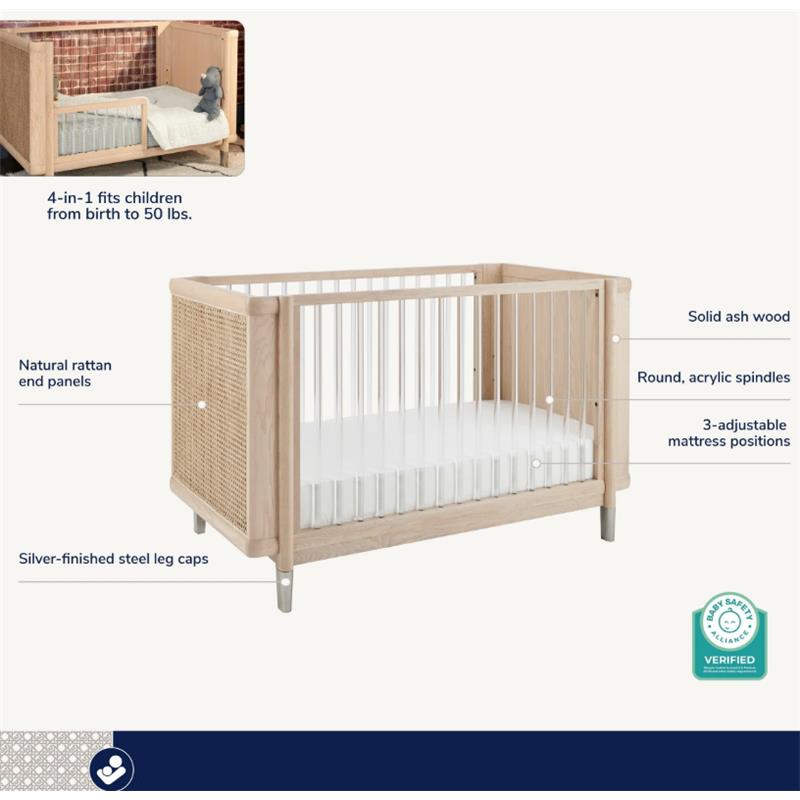 4-in-1 convertible crib with natural rattan end panels, solid ash wood, and adjustable mattress positions.