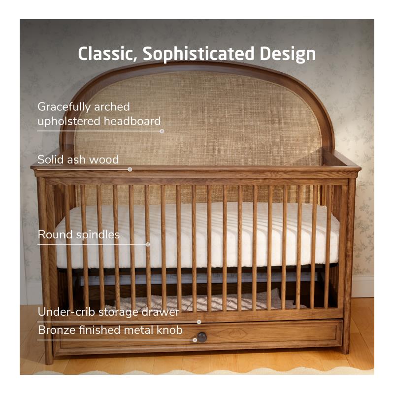 Maxi Cosi Quiet Luxury 6-in-1 Convertible Crib featuring an arched upholstered headboard, solid ash wood, and under-crib storage drawer.