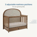 Maxi Cosi Quiet Luxury 6-in-1 Convertible Crib featuring three adjustable mattress positions for newborns, rolling babies, and standing toddlers.