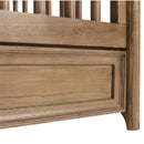 Maxi Cosi Quiet Luxury 6-in-1 Convertible Crib with a natural wood finish, featuring a horizontal slatted design and a sturdy base.