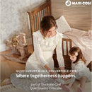 Mom and child interact beside the Maxi Cosi Quiet Luxury 6-in-1 Convertible Crib in a cozy, stylish nursery.