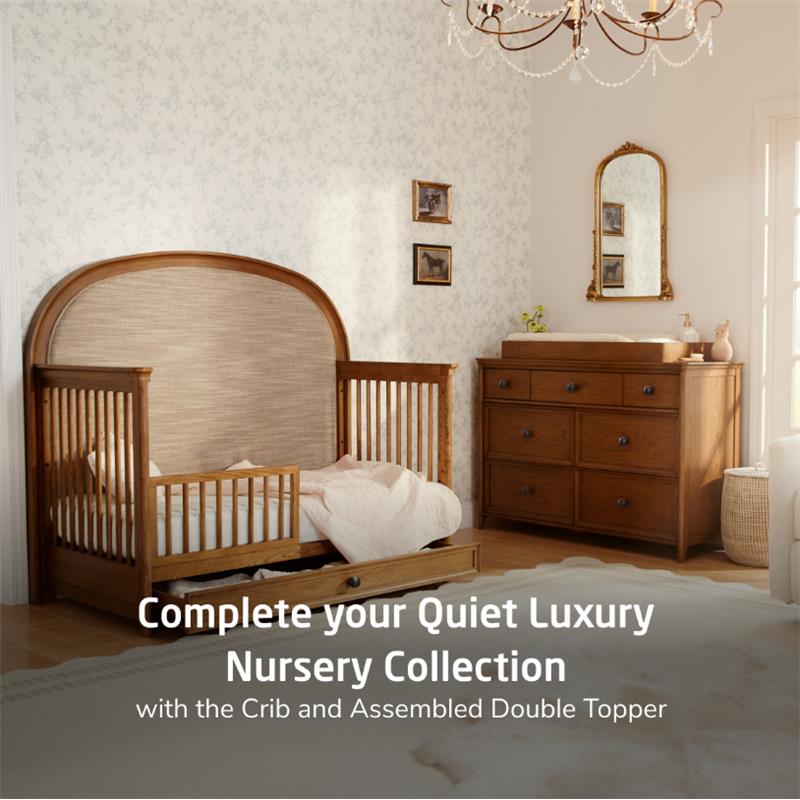 Maxi Cosi Quiet Luxury 7-Drawer Dresser in a nursery setting with a crib, soft textures, and decorative elements.