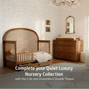 Maxi Cosi Quiet Luxury 7-Drawer Dresser in a nursery setting with a crib, soft textures, and decorative elements.