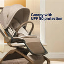 Maxi-Cosi Tana 360 rotating stroller featuring a canopy with UPF 50 protection and a comfortable seating area in natural colors.