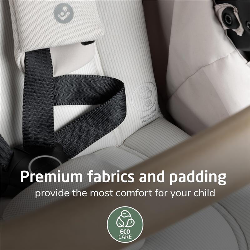 Maxi-Cosi Zelia Pro 5-in-1 Travel System featuring premium fabric and padding for child comfort, with Eco Care logo visible.