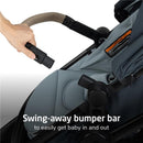 Maxi-Cosi Zelia Pro 5-in-1 Travel System in SeaScape with a hand demonstrating the swing-away bumper bar for easy access.