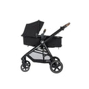 Maxi-Cosi Zelia2 Luxe 5-in-1 Modular Travel System in New Hope Black with a sleek design, featuring adjustable canopy and sturdy wheels.
