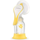 Manual breast pump with Flex Shields from Medela, featuring a white and yellow design, attached to a clear milk bottle.