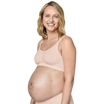 Maternity and nursing bra by Medela displayed on a pregnant model, highlighting comfort and support in chai color.