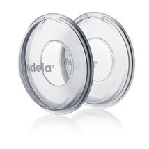Milk collection shells by Medela, clear design with an inner opening, ideal for collecting breast milk.