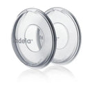 Milk collection shells by Medela, clear design with an inner opening, ideal for collecting breast milk.