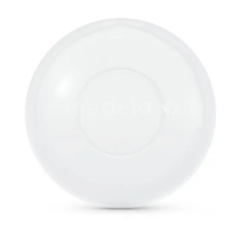 Milk collection shells by Medela, featuring a clear, round design for collecting excess milk during breastfeeding.