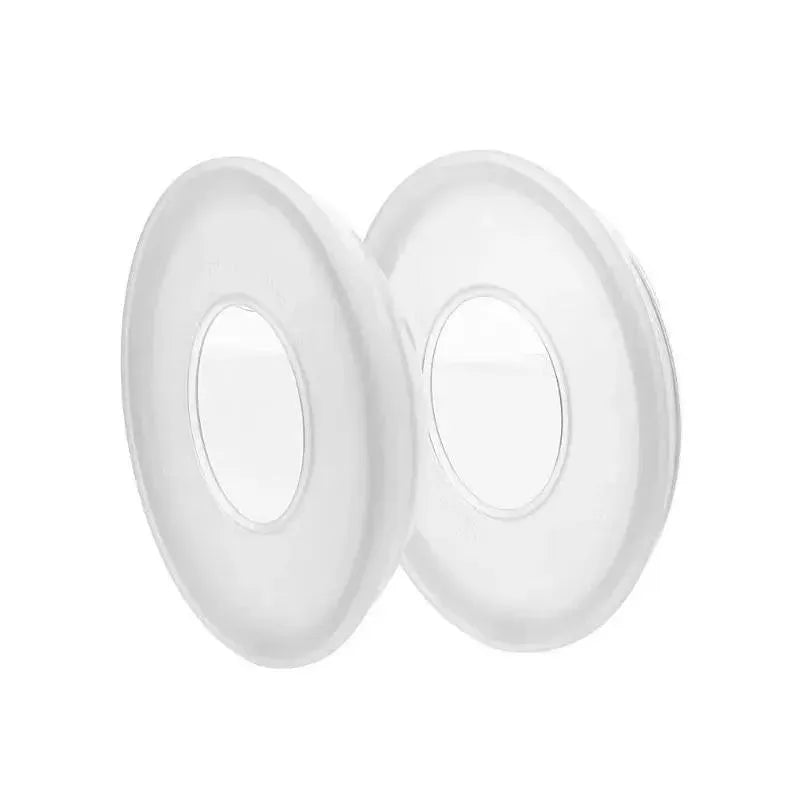 Breastfeeding accessories featuring two transparent Medela TheraShells designed for comfort and protection.
