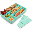 Divided snack container in blue with 12 compartments, filled with fruits, snacks, and a pair of removable dividers.