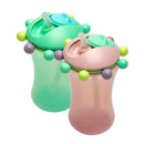 Two colorful sippy cups, one mint green and one pink, with decorative balls and straws for easy drinking.