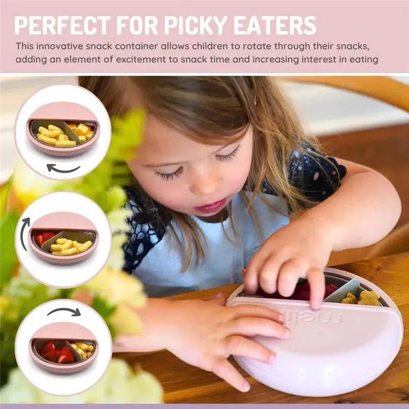 Pink Melii snack container with three compartments, filled with snacks, as a child engages with it during snack time.