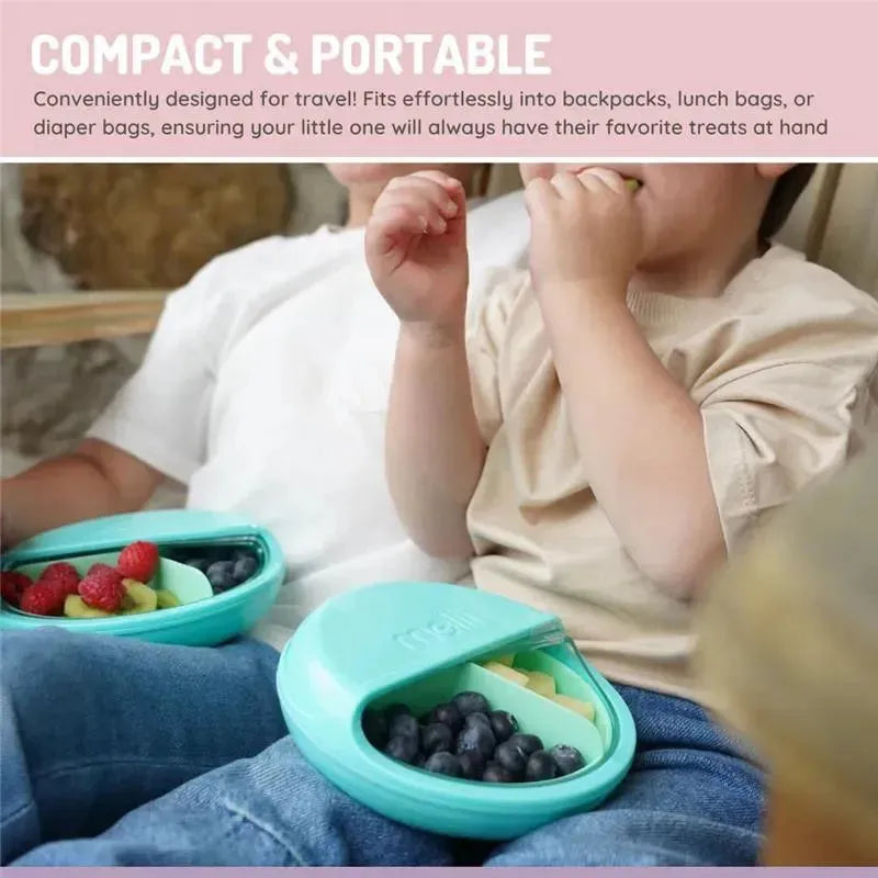 Pink Melii 3 Compartments Spin Snack Container filled with blueberries, grapes, and raspberries, held by children sitting together.