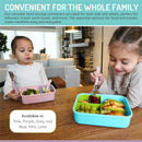 Bento boxes with removable dividers in blue and mint, filled with fruits and snacks, used by two smiling girls at a table.
