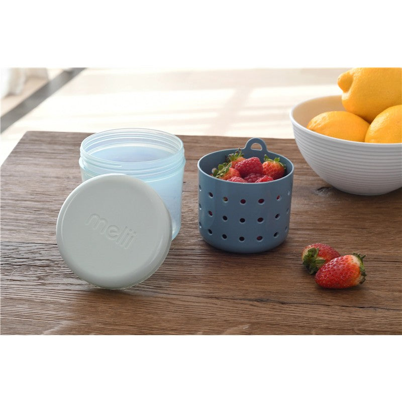 Melii Fruit Storage Container with Strainer in blue, featuring a clear lid and filled with strawberries and raspberries.