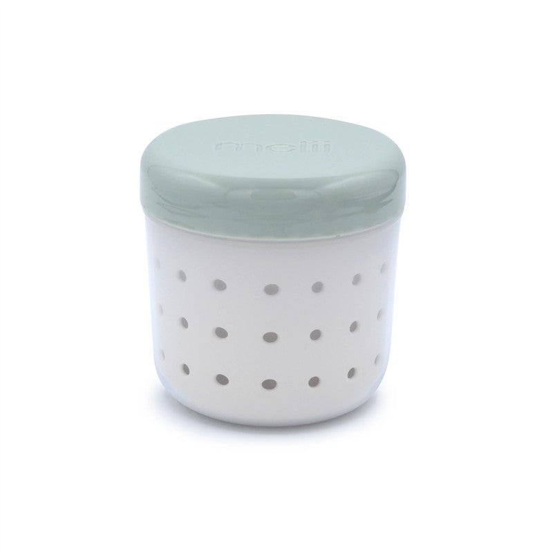 Melii Fruit Storage Container in sage and ivory, featuring a strainer design with small perforations for ventilation.