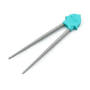 Shark-themed chopsticks with a turquoise plastic head and gray tapered tips, designed for training.