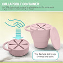 Collapsible pink silicone container with a secure lid designed for snacks, featuring two handles and a capacity of 10.7 fl oz.