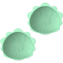 Silicone suction bowls for babies and toddlers, shaped like dinosaurs, in a soft green color.
