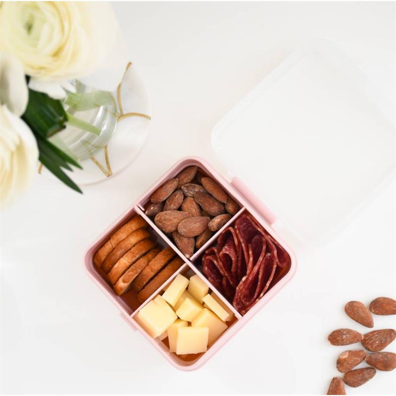 Melii Snackle Box in petite pink, featuring four compartments filled with nuts, cheese cubes, meat slices, and crackers.