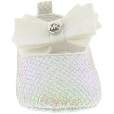 White Michael Kors baby girl crib shoe featuring a textured design and a satin bow, with an MK logo detail.