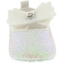 White Michael Kors baby girl crib shoe featuring a textured design and a satin bow, with an MK logo detail.