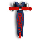 Navy blue Micro Kickboard Mini Deluxe LED scooter featuring red handles and bold logo on the deck.