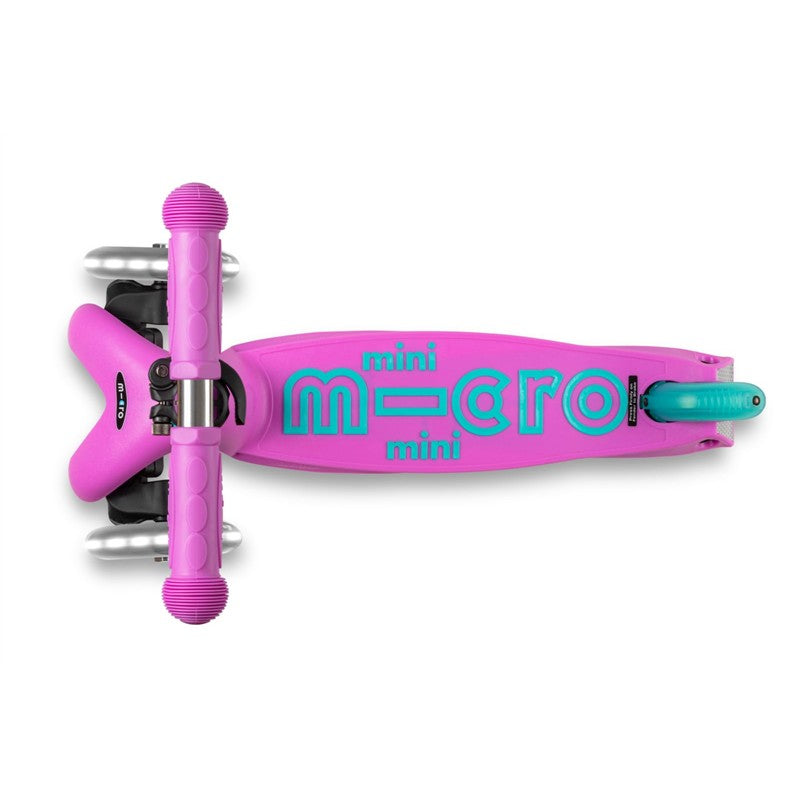 Lavender Micro Kickboard Mini LED Scooter featuring a bright pink deck with teal lettering and sturdy handlebars.