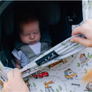 5-in-1 multifunctional cover featuring Disney and Pixar Cars design, being used to cover a sleeping baby in a car seat.