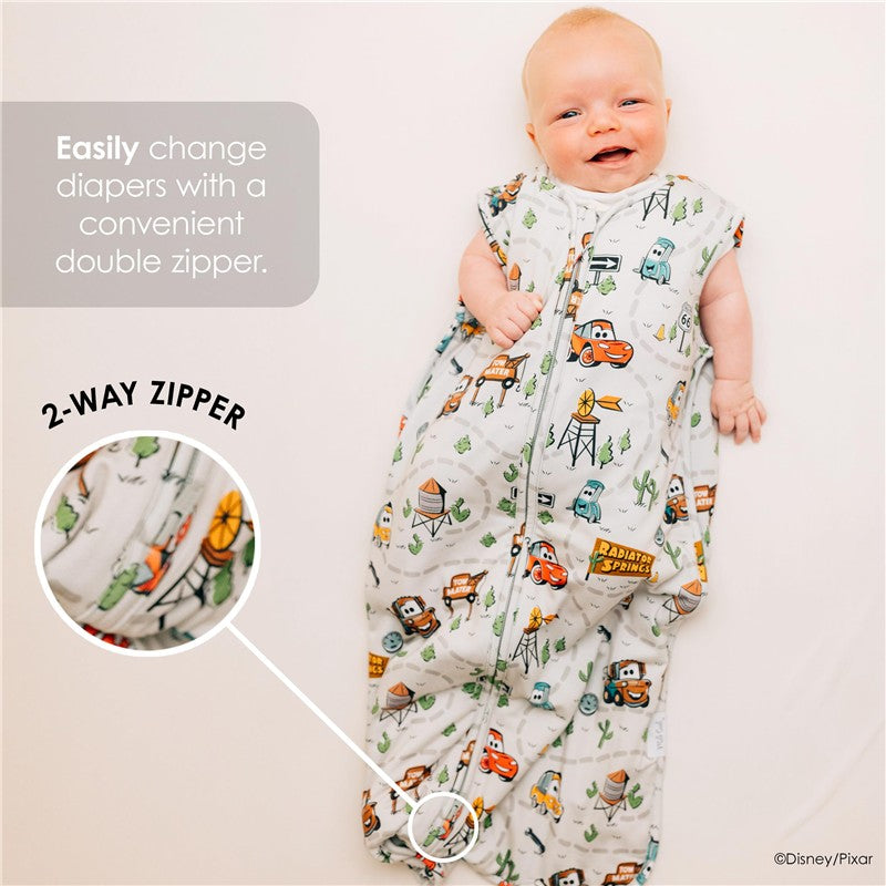 Milk Snob Disney Pixar Cars baby sleep bag featuring a 2-way zipper and colorful car-themed prints, designed for 0-6 months.
