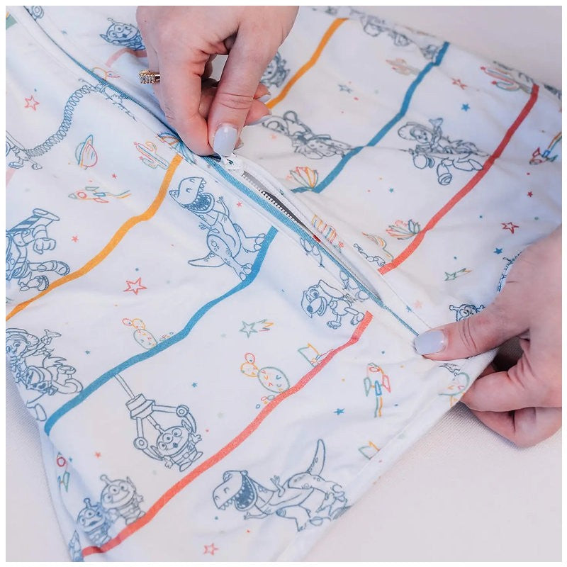 Milk Snob Toy Story baby sleep bag with playful character designs, featuring a zipper for easy use, suitable for 0–6 months.