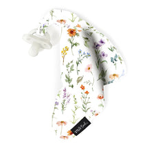 Soft white baby security blanket with colorful floral prints and an attached pacifier, branded Milk Snob.