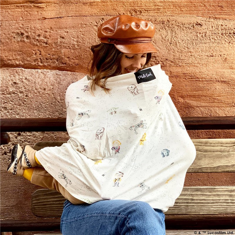 Star Wars™ Little Galaxy 5-in-1 multifunctional cover worn by a smiling woman with a brown cap, featuring colorful characters on a white background.