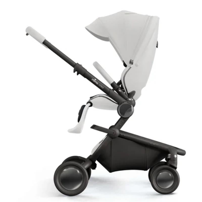 Mima Creo Single Stroller in white, featuring an adjustable seat, black frame, and large wheels for easy maneuverability.