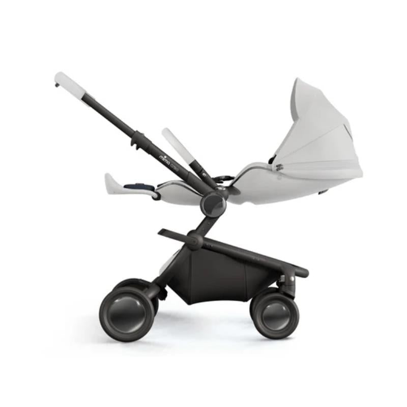 Mima Creo Single Stroller in white, featuring a reclining seat, adjustable handle, and four wheels for easy maneuvering.